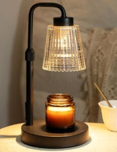 Candle warmer lamp melting a jar candle with adjustable dimming for flameless fragrance